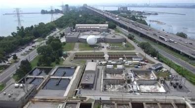 Aerial view of a treatment facility near a highway and waterfront