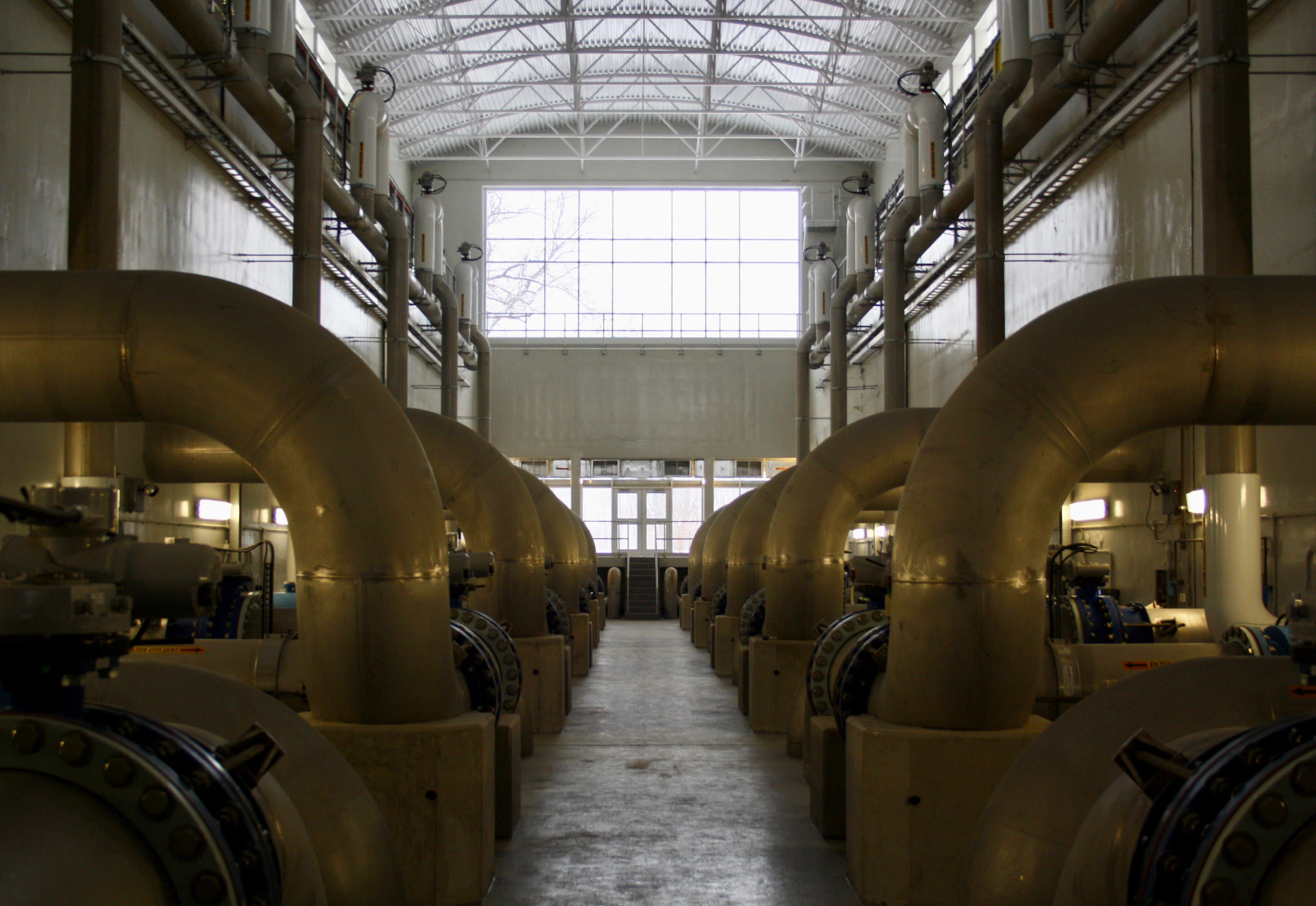 Large industrial pipework inside a treatment facility